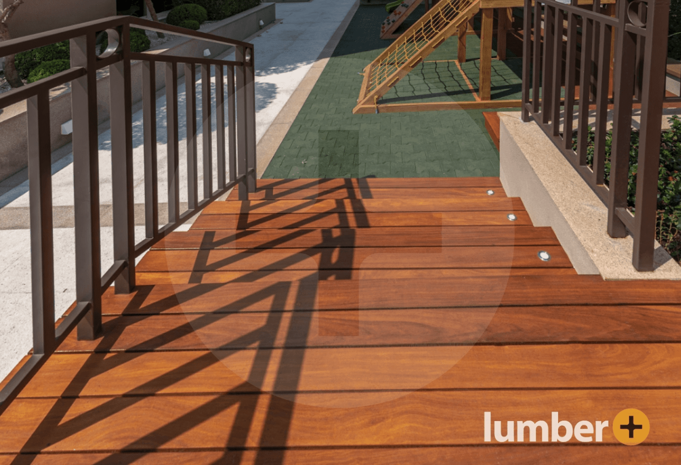 Wooden deck stairs with matching railings adding style and safety.