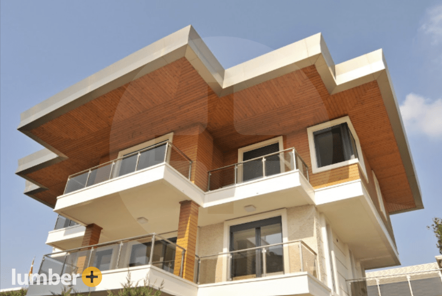 Thermowood Pine adds a bold touch to this sharp modern roofline.