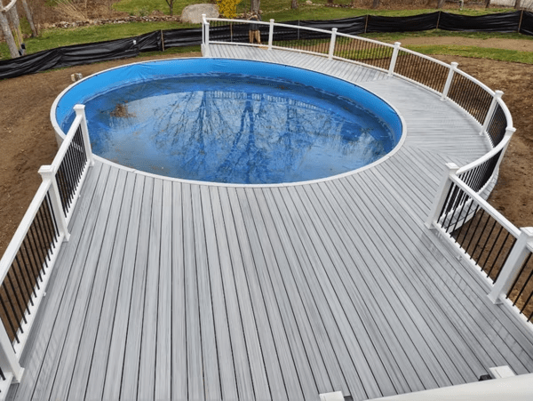 Partial wrap deck for round pool—fits top above ground pool deck ideas.