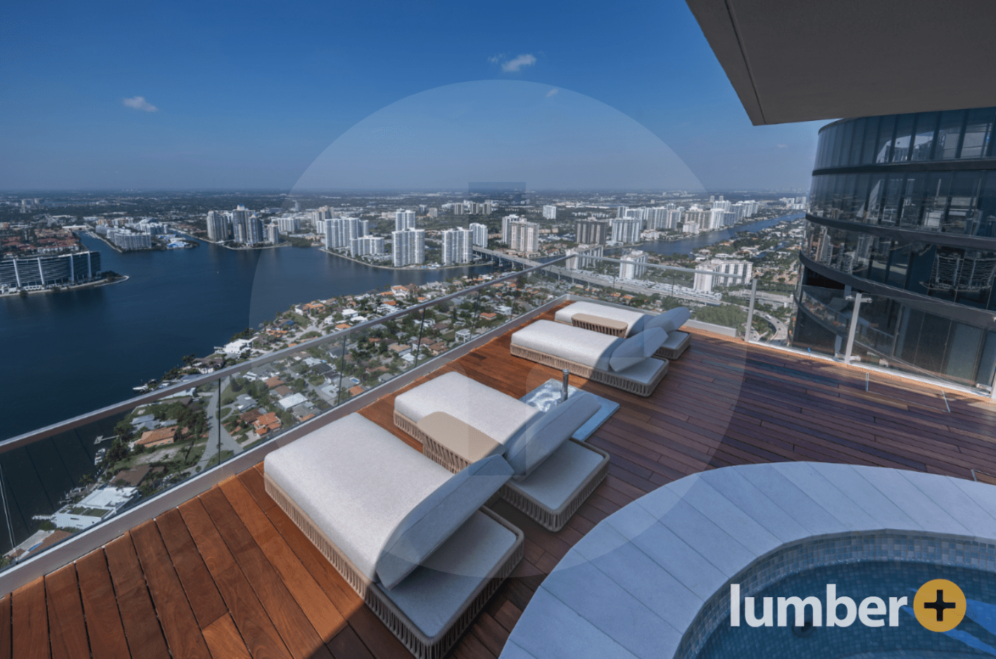 an image of a Ipe wood pool deck overlooking a body of water and residential homes