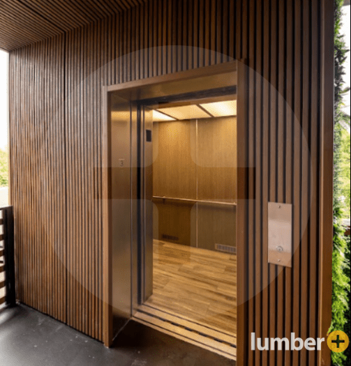 Elevator entrance surrounded by vertical wood-look composite panels.
