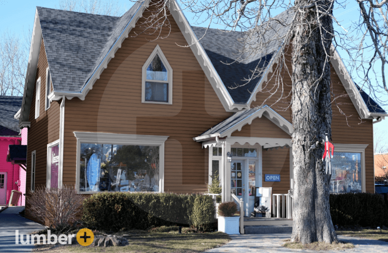 An image of a house with dark brown composite siding. 