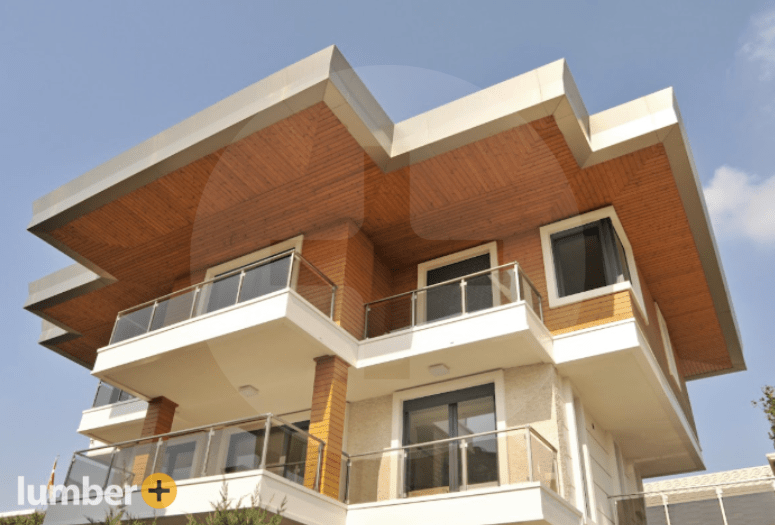 An image of a two story house with composite siding on the ceiling and exterior walls. 