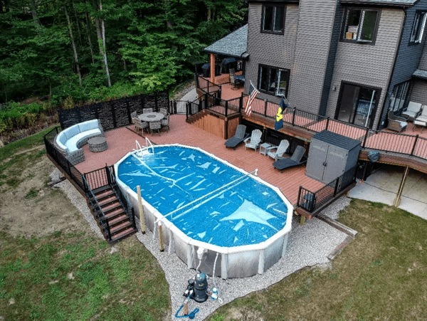 Elevated wraparound with entertaining zones—ideal for above ground pool deck ideas.