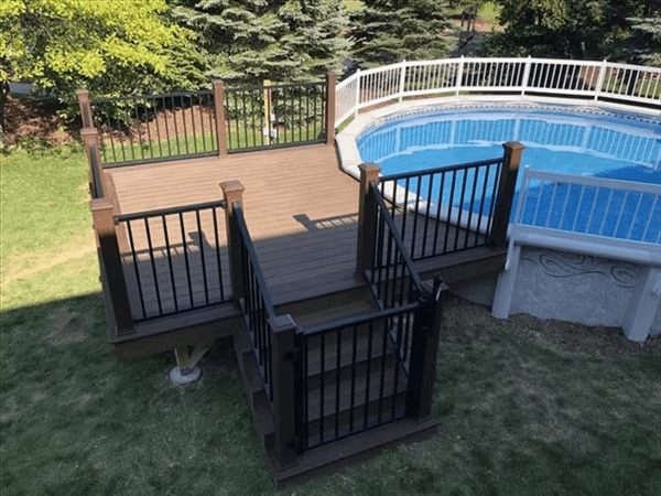 Compact platform with ground-level gate—great for above ground pool deck ideas.