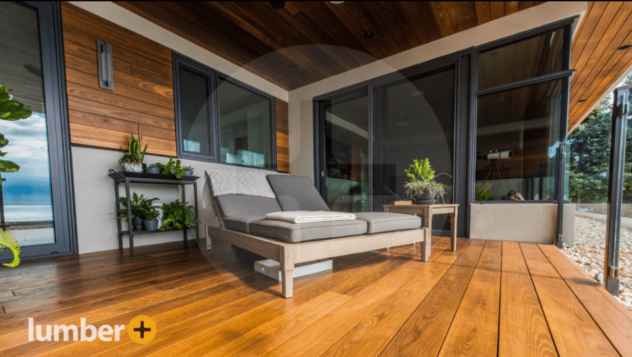An image of an outdoor patio cladded with wood walls and deck.