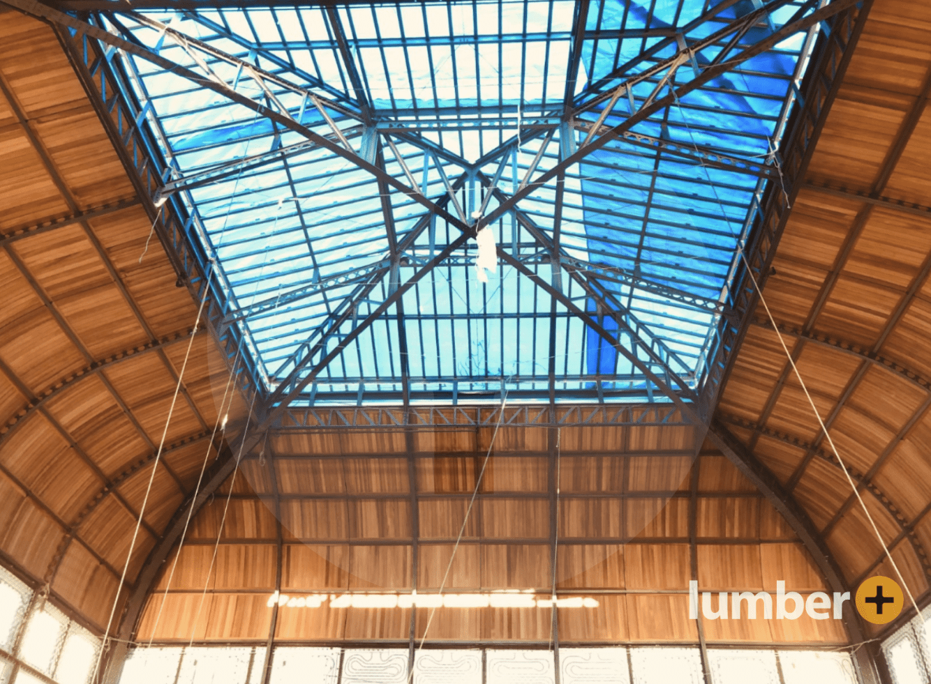 the curve wood ceiling with steel web trusses of a large community center design