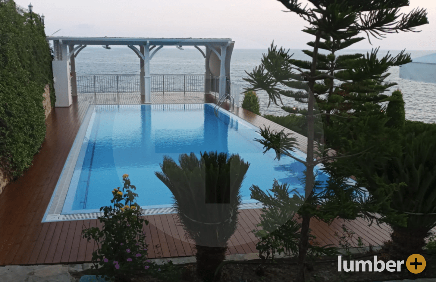 an image of a Thermo Pine deck around a pool