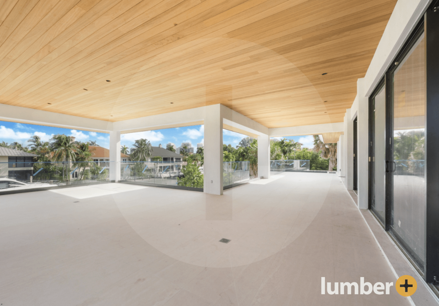 a large open balcony area with a Thermo Ayous wood