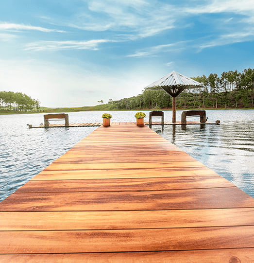 A Lumber Plus Tigerwood decking floating on a lake.