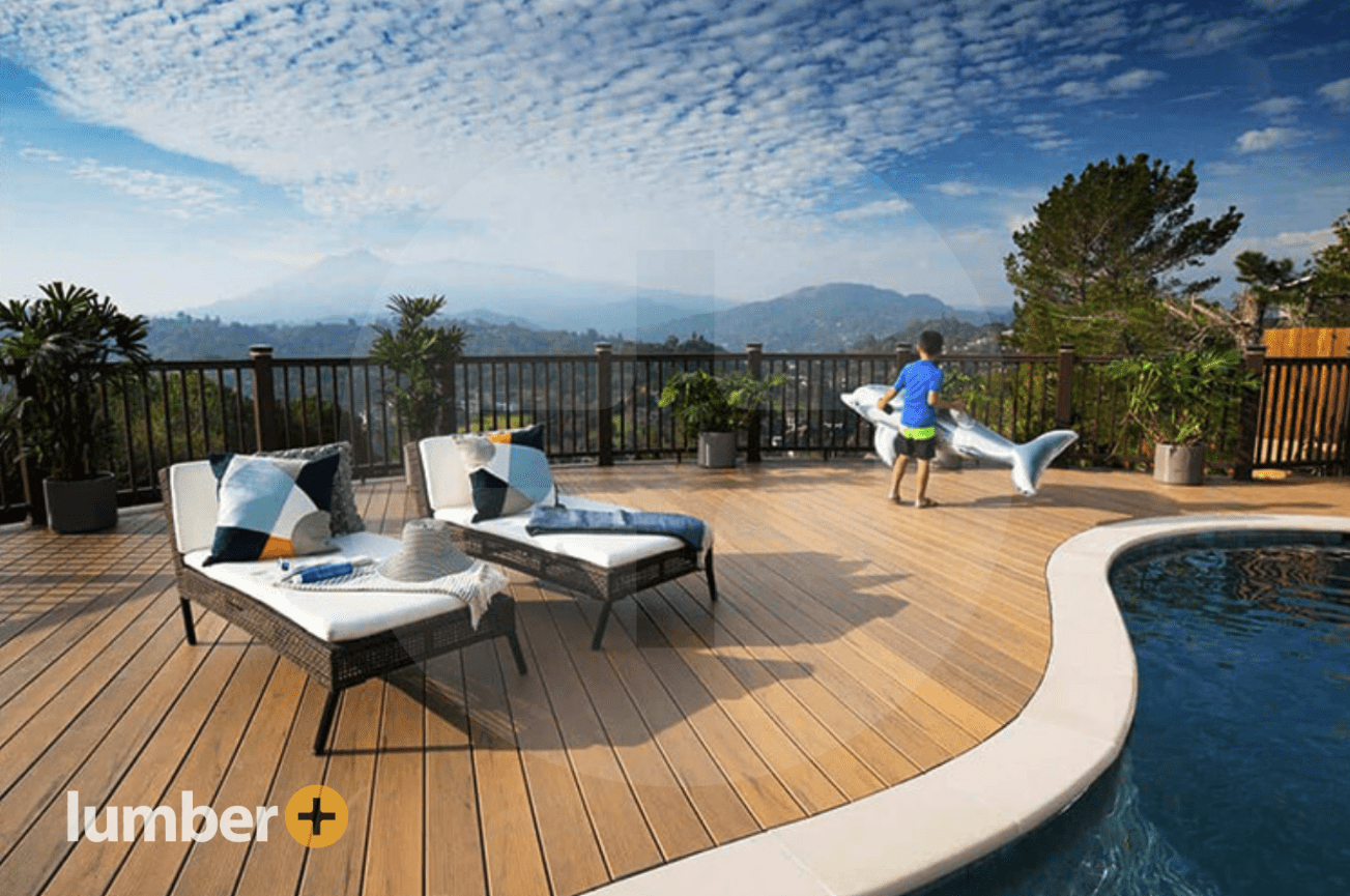 Wood grain decking planks next to a swimming pool in the mountains. 