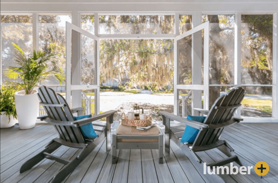 Adirondack chairs on a screened in wooden porch with french doors. 