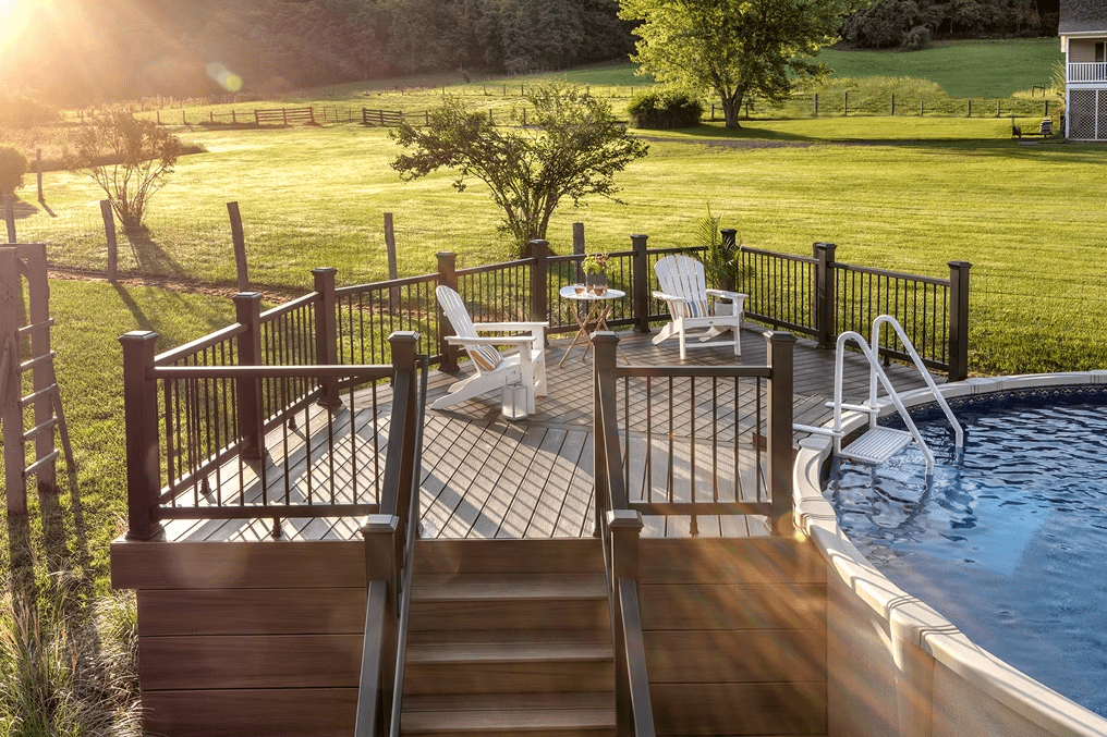 Trex pool deck design in Coastal Bluff, built around an above-ground pool with classic brown tones to blend with natural surroundings.