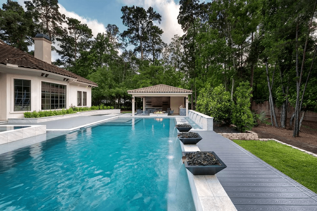 Trex pool deck in Pebble Gray, providing a seamless and uniform style for a modern outdoor space.