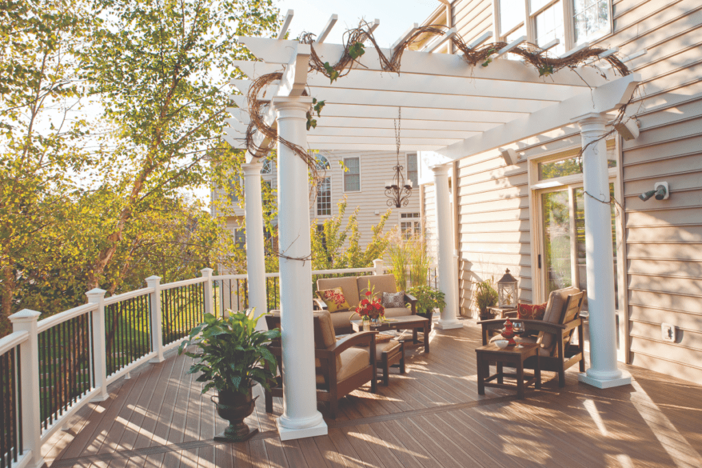 Trex deck with a curved layout and modern railing, blending seamlessly with natural surroundings.