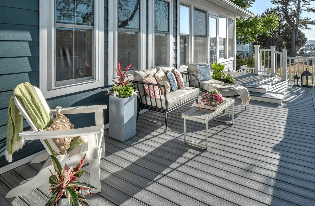 A Trex Enhance® deck in Trex decking color option Foggy Wharf, featuring light gray and white tones.