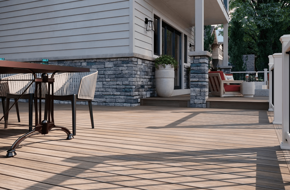 A Trex Enhance® deck in Honey Grove, featuring rich golden-brown tones.