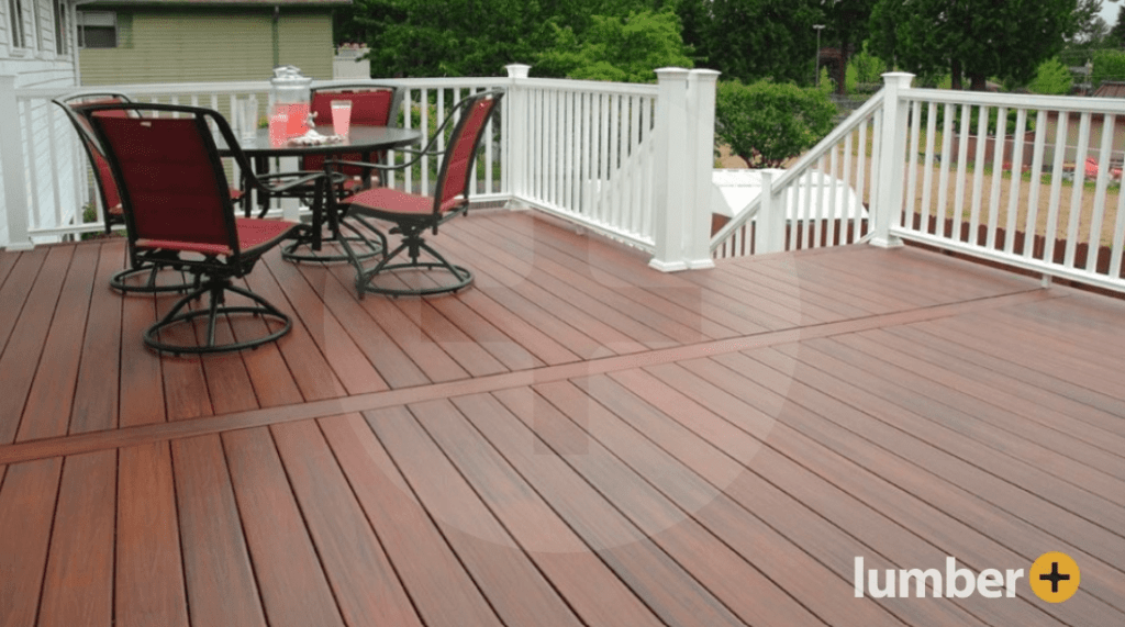 A stunning wooden deck adorned with red patio furniture.