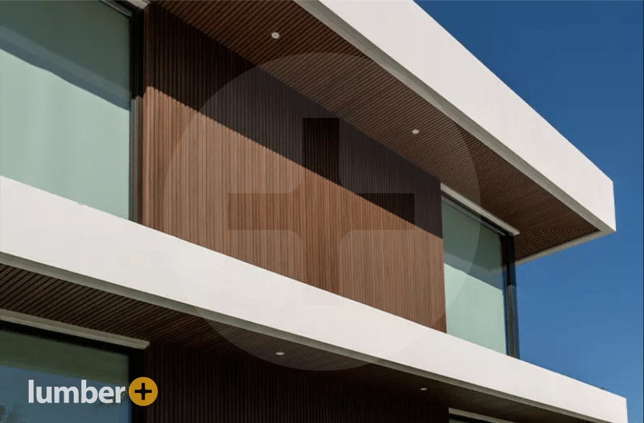 Dark wood siding trimmed with white on the side of a house.