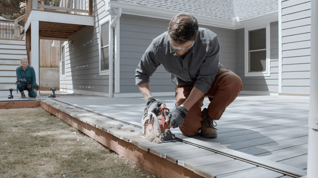 An image of a contractor replacing his current deck with Trex deck boards.