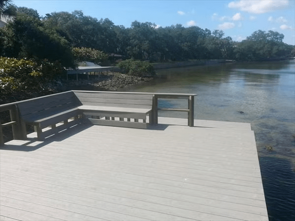 Trex floating dock design features built-in seating along the edge for a comfortable seating area.