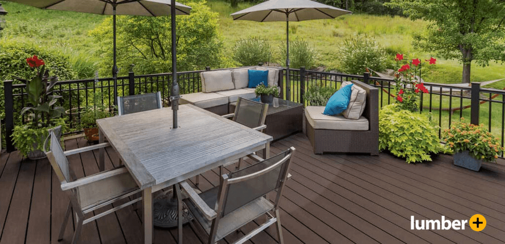 Dark brown composite deck with iron railing and outdoor furniture