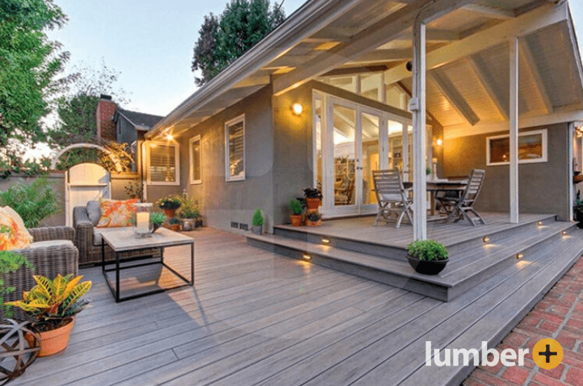 Gray composite deck with steps and outdoor seating area.