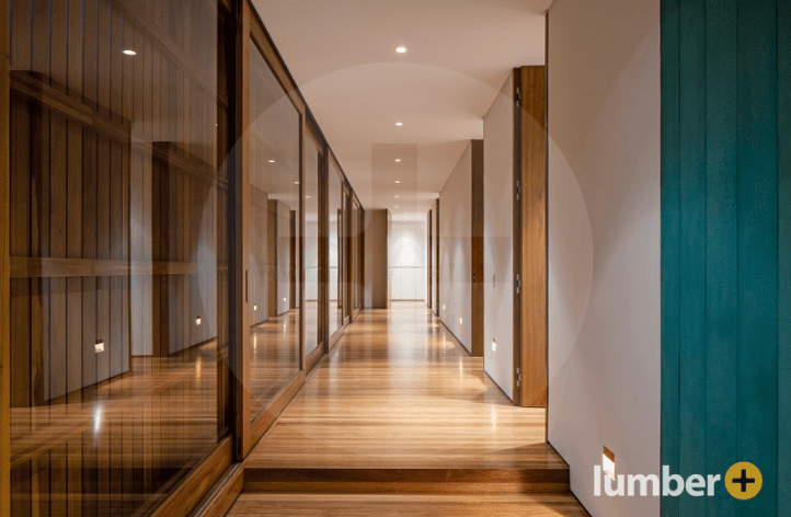 An image of a wooden feature wall inside of a retail office space.