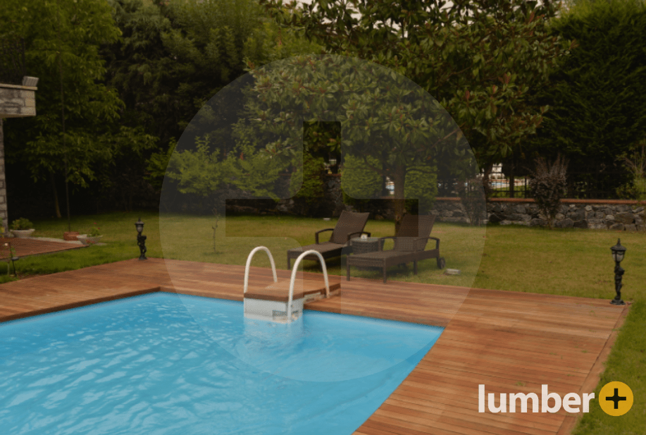 Fire-resistant decking material surrounding an underground pool.