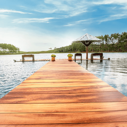 A Lumber Plus Tigerwood decking floating on a lake.