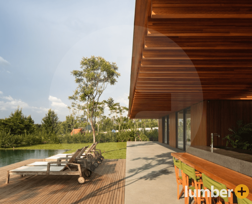 Wood canopy and wood patio design overlooking water