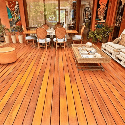 An Ipe hardwood deck with outdoor dining table and furniture.