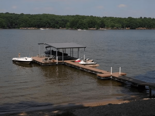 Floating Trex deck design with a covered area and designated boat spaces.