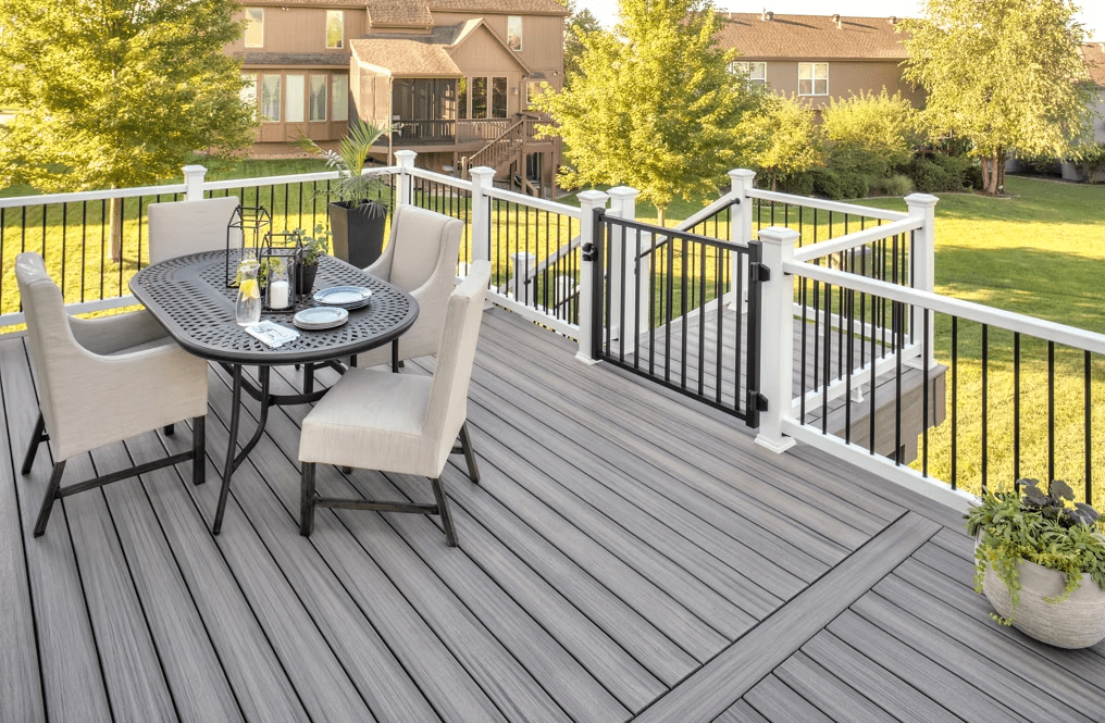 A Trex Enhance® deck in Rocky Harbor, showcasing light brown and gray tones.