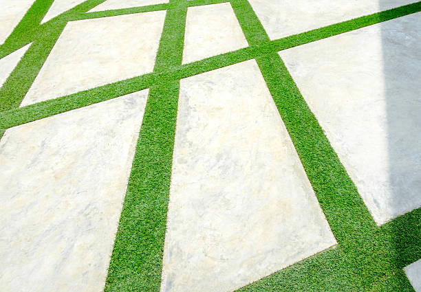 Artificial grass installed between pavers for a clean, modern look.