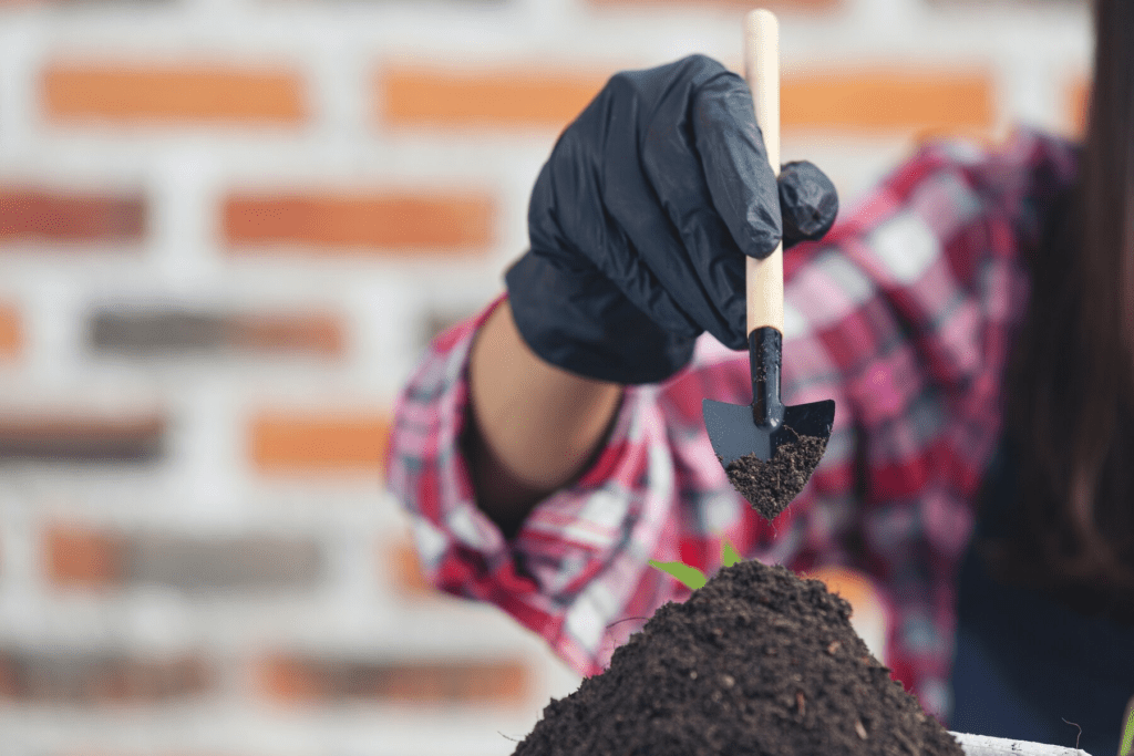 a person assessing the soil to start building a deck in Florida