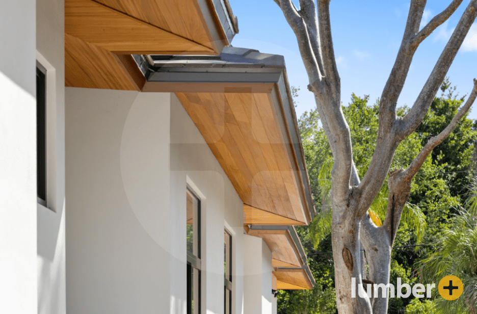 Wooden soffits on a white house in a neighborhood. 