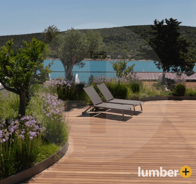 A luxury deck that has Thermo Ash wood with a view above a lake.