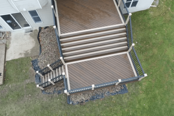 A drone image of a two-tone Trex deck using a dark brown with light cream trim.