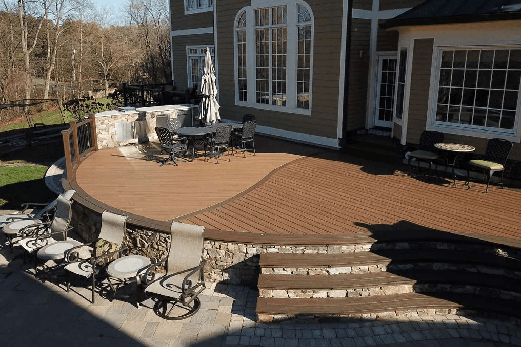 Trex deck stairs in brown and natural stone an earthy look.