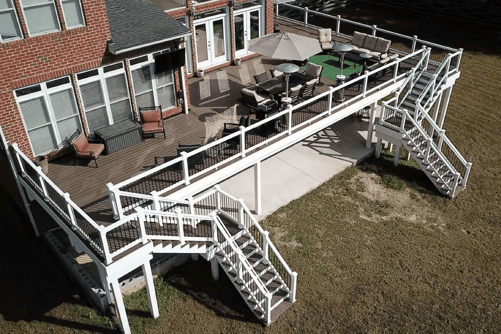 Trex deck stairs in warm brown tones and contrasting white handrails.