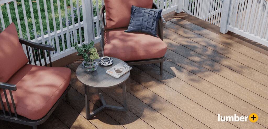 Wood deck patio surrounded by white fence and red patio chairs.