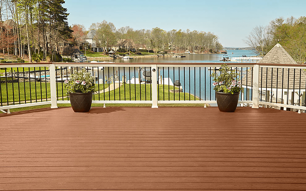A spacious deck made with Trex composite materials overlooks a large backyard.