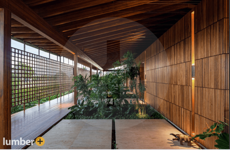 Covered walkway with Ipe wood walls and ceiling beams.