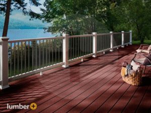A backyard deck featuring white railing and vertical balusters.