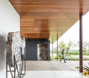 Hardwood ceiling installation on the back exterior of a building.