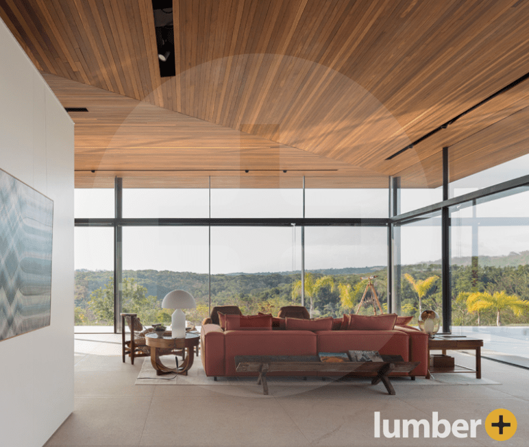 Hardwood ceiling installation inside a home with floor-to-ceiling windows.