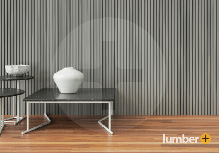 An image of a modern interior with gray vertical slat wall paneling and minimalist furniture.