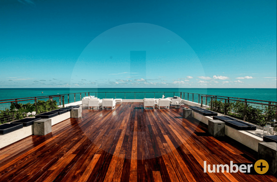 Dark Multi-toned rooftop deck surrounded on all sides by water.