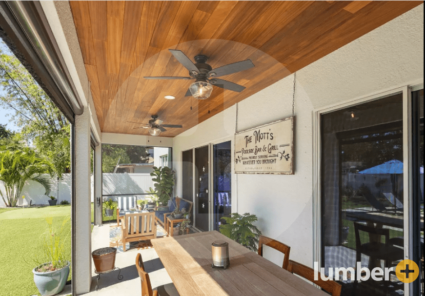 Wood panel ceiling on an outdoor back patio sunroom.